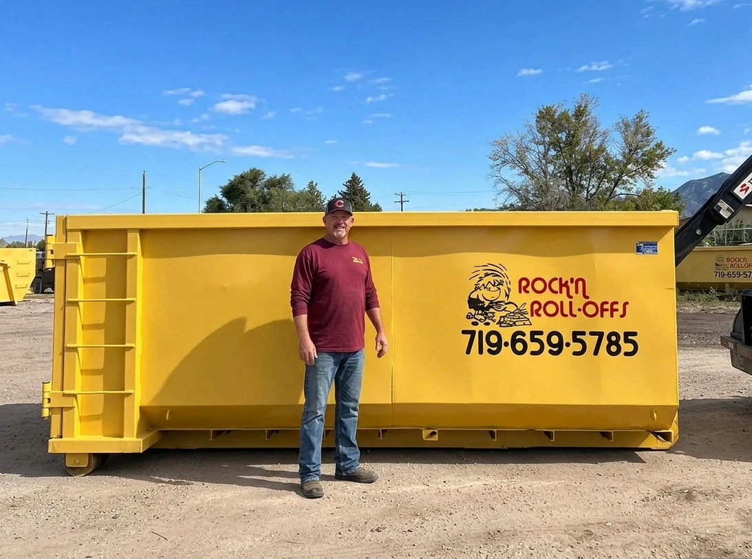 18 cubic yard Rock'n Roll-Offs roll-off dumpster with a person standing beside it for scale
